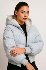Light blue puffer jacket with hood and faux shearling lining, cozy winter outerwear for women.2