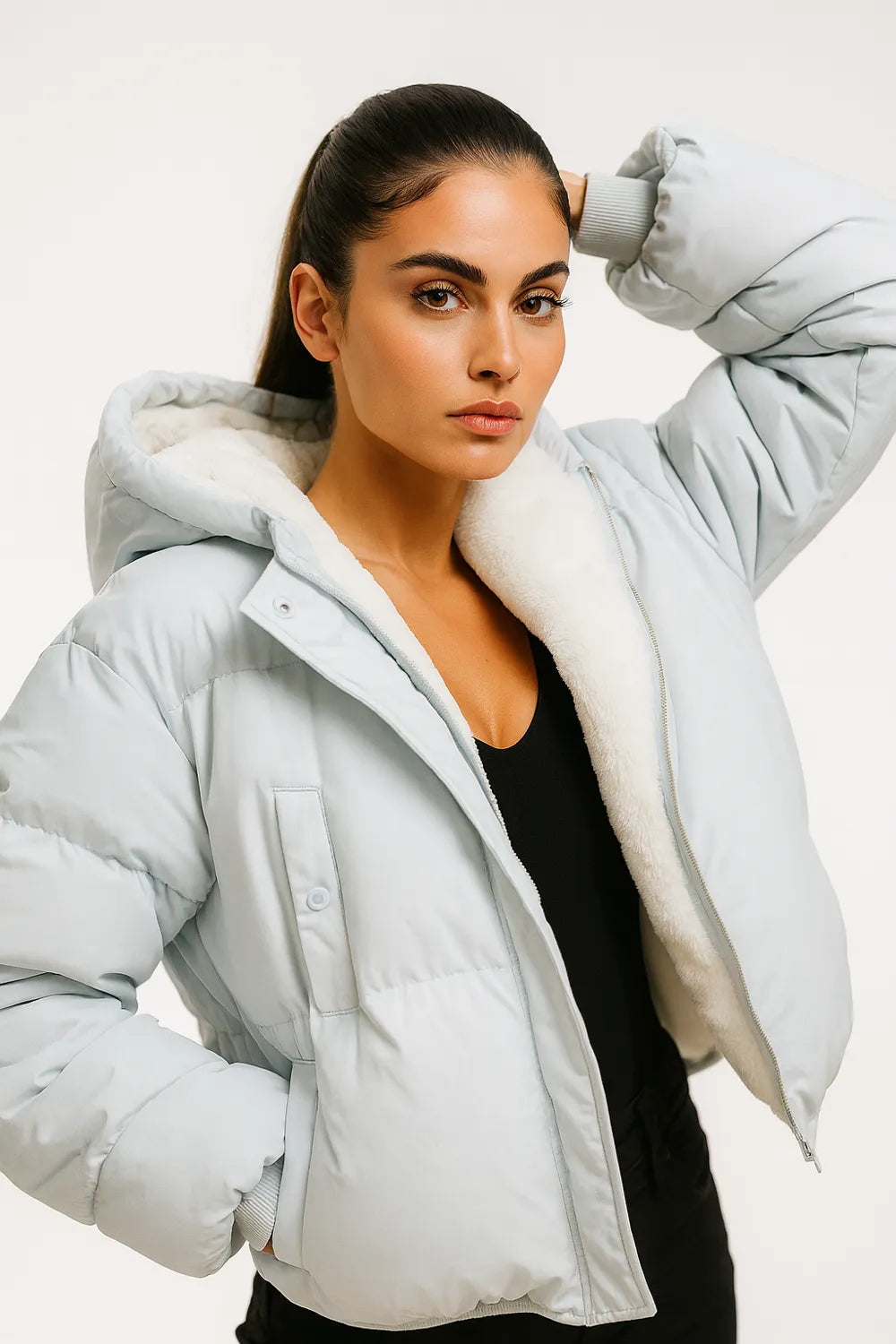 Light blue puffer jacket with hood and faux shearling lining, cozy winter outerwear for women.