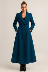 Elegant women's teal trench coat with flared maxi length and double-breasted buttons